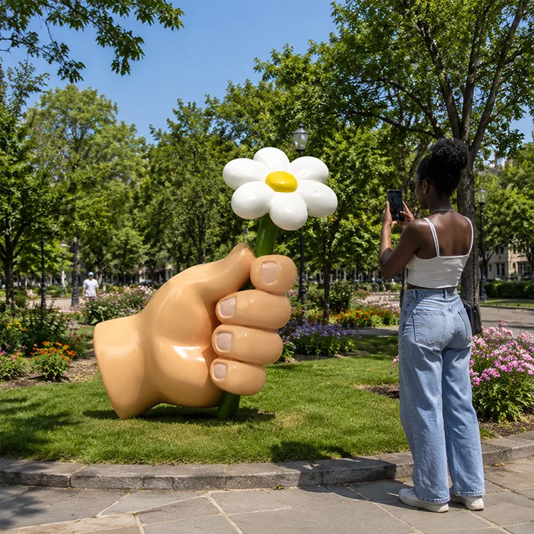 Hand Holding Flower Sculpture